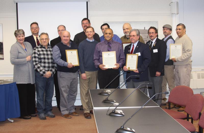 "Nights of Hospitality" representatives accept a formal certificate of recognition from Selectmen on Tuesday. The group, composed of volunteers and area clergy, provides services for the homeless. BY MATTHEW BERNAT